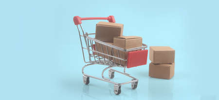 Toy shopping cart with boxes shopping and delivery concept. Consumer society trendの写真素材