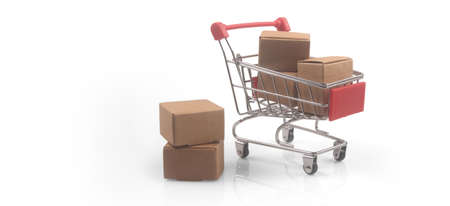 Toy shopping cart with boxes shopping and delivery concept. Consumer society trendの写真素材