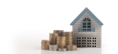 Model of detached miniature house mock and coins. property real estate investment conceptの写真素材