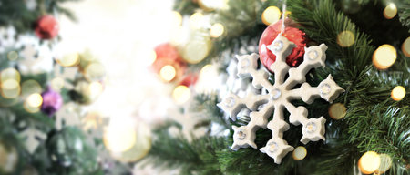 Decorated Christmas tree hanging on pine branches  and ornamentsの写真素材