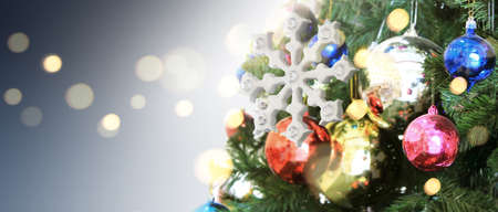 Decorated Christmas tree hanging on pine branches  and ornamentsの写真素材