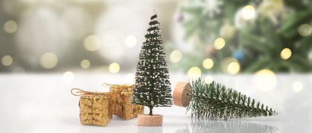 Decorated Christmas tree hanging on pine branches gift boxes  and ornamentsの写真素材