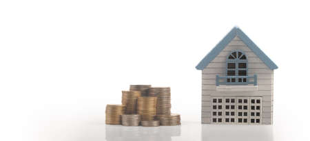 Model of detached miniature house mock and coins. property real estate investment conceptの写真素材