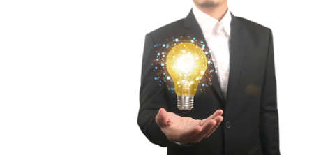 Hand of holding illuminated light bulb, idea, innovation inspiration conceptの写真素材
