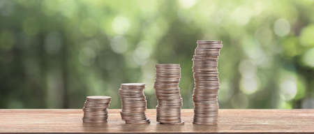 Stack of a coin with trading graph, financial investment conceptの写真素材