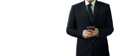 Man holding smartphone device and touching screenの写真素材