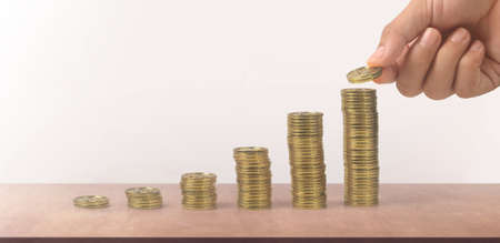 Stack of a coin with trading graph, financial investment conceptの写真素材