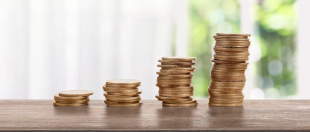 Stack of a coin with trading graph, financial investment conceptの写真素材