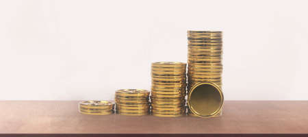 Stack of a coin with trading graph, financial investment conceptの写真素材