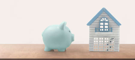 Model of detached miniature house mock and Piggy bank. property real estate investment conceptの写真素材