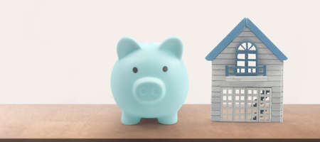 Model of detached miniature house mock and Piggy bank. property real estate investment conceptの写真素材