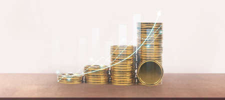 Stack of a coin with trading graph, financial investment conceptの写真素材