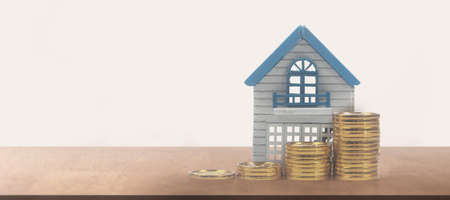 Model of detached miniature house mock and coins. property real estate investment conceptの写真素材