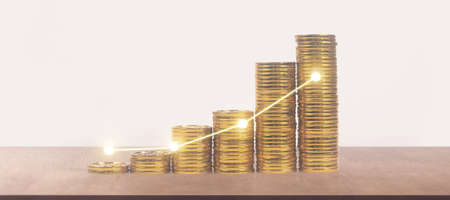 Stack of a coin with trading graph, financial investment conceptの写真素材