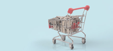 Toy shopping cart with coins and Consumer society trendの写真素材