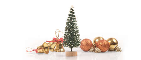 Decorated Christmas tree hanging on pine branches gift boxes  and ornamentsの写真素材