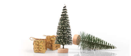 Decorated Christmas tree hanging on pine branches gift boxes  and ornamentsの写真素材