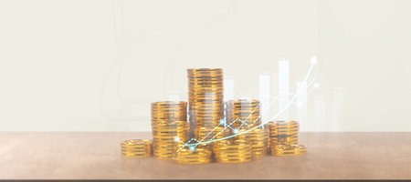 Stack of coin with trading graph, financial investment concept