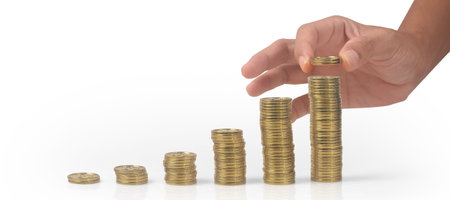 Stack coin in hand with trading graph, financial investment concept