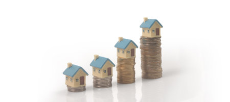 Model of detached miniature house mock and coins. property real estate investment conceptの写真素材