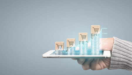Coin and wealth concept. Loads of money on glass representing digital tablet