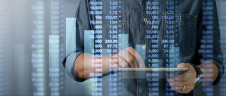 Hand touching  graphs of financial indicator and accounting market economy analysis chart