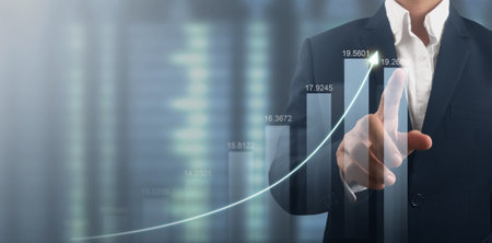 Hand touching  graphs of financial indicator and accounting market economy analysis chartの写真素材