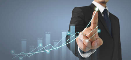Businessman plan graph growth and increase of chart positive indicators in his businessの写真素材
