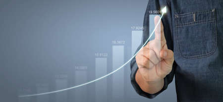 Businessman plan graph growth and increase of chart positive indicators in his businessの写真素材