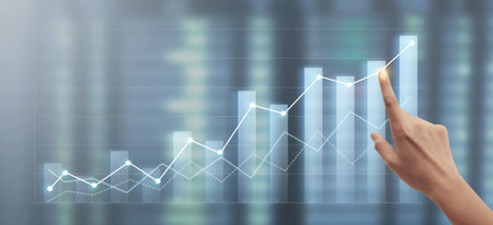 Hand touching  graphs of financial indicator and accounting market economy analysis chartの写真素材