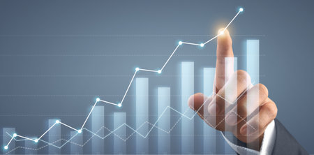 Hand touching  graphs of financial indicator and accounting market economy analysis chartの写真素材