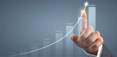 Hand touching  graphs of financial indicator and accounting market economy analysis chartの写真素材