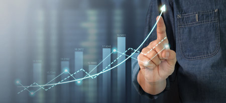 Businessman plan graph growth and increase of chart positive indicators in his businessの写真素材