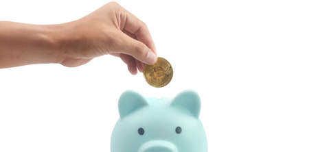 Bitcoin with financial investment in hand  concept and Piggy bankの写真素材
