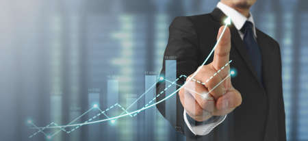 Businessman plan graph growth and increase of chart positive indicators in his businessの写真素材