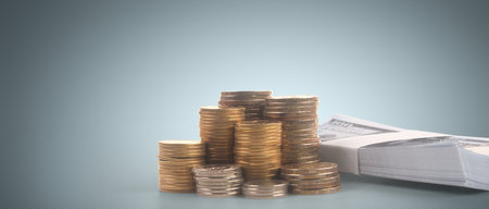 Model of detached miniature house mock up and coins. property real estate investment conceptの写真素材