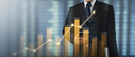 Mand holding smartphone device and touching screen. Stock exchange market concept. Trader looking on...