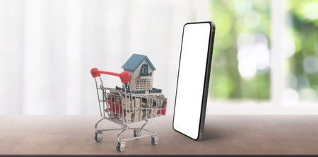 Toy shopping cart Consumer society trend on smartphoneの写真素材