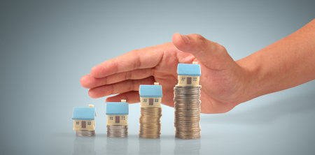 House Residential Structure in hand ,business home idea, model house and coinの写真素材