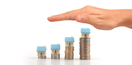 House Residential Structure in hand ,business home idea, model house and coinの写真素材