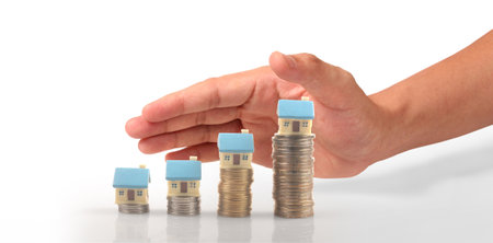House Residential Structure in hand ,business home idea, model house and coinの写真素材