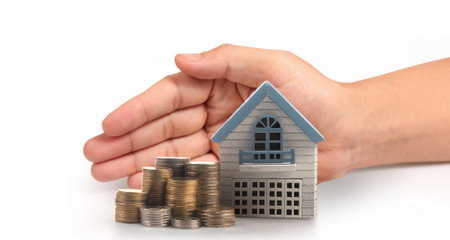 House Residential Structure in hand ,business home idea, model house and coinの写真素材