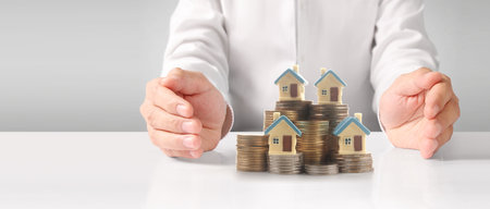 House Residential Structure in hand ,business home idea, model house and coinの写真素材