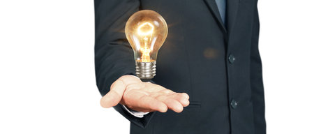Man hold light bulbs in hand innovative technology and creativityの写真素材