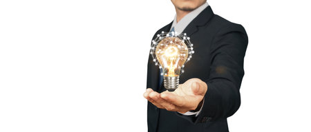 Man hold light bulbs in hand innovative technology and creativityの写真素材