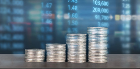 Stack of coin with trading graph, financial investment conceptの写真素材