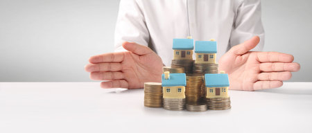 House Residential Structure in hand ,business home idea, model house and coinの写真素材