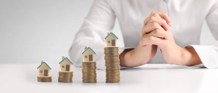 House Residential Structure in hand ,business home idea, model house and coinの写真素材