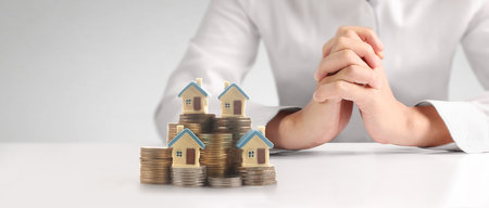 House Residential Structure in hand ,business home idea, model house and coinの写真素材