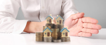 House Residential Structure in hand ,business home idea, model house and coinの写真素材
